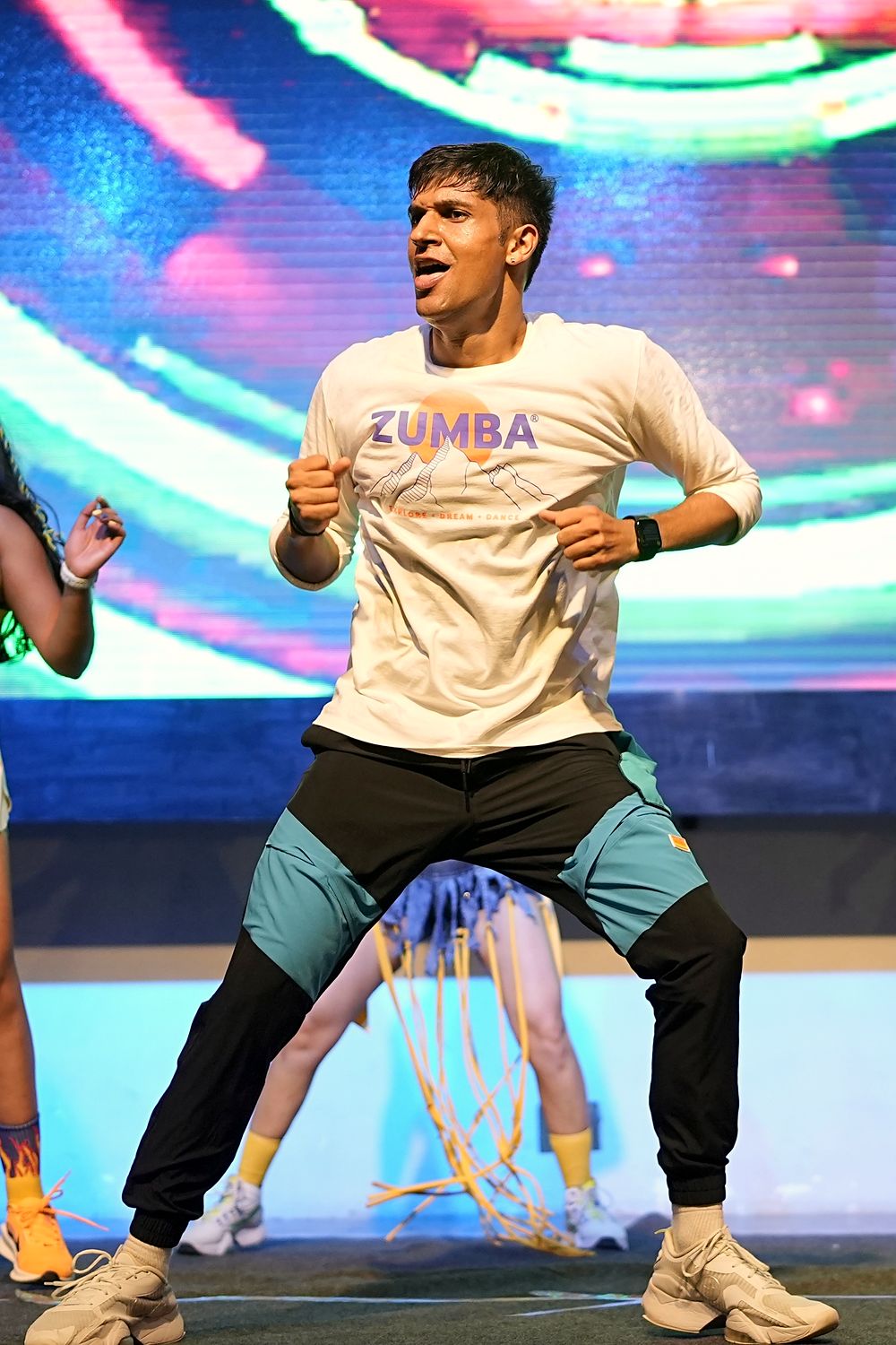 Jay Mangal, licensed Zumba instructor, dancing on stage